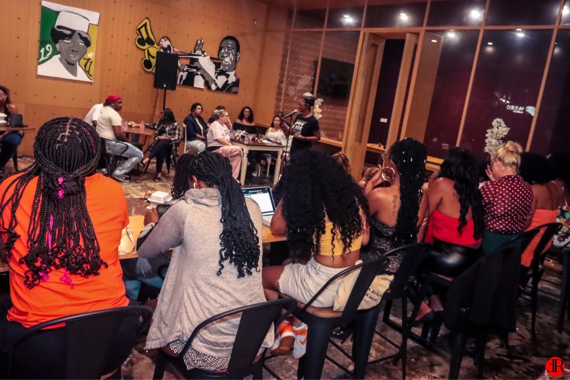 Audience members gathered at a Rhythm And Poetry event