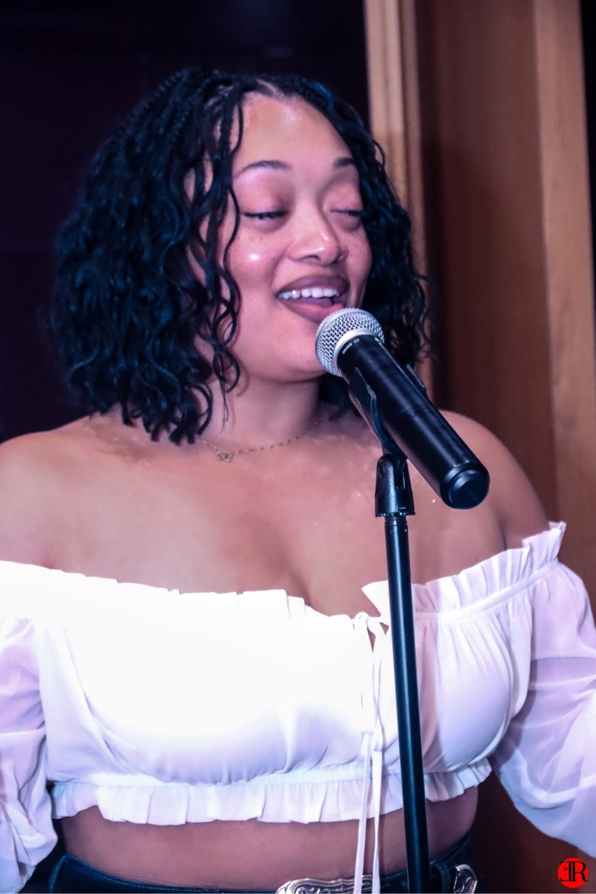 Close-up of a singer performing into a microphone